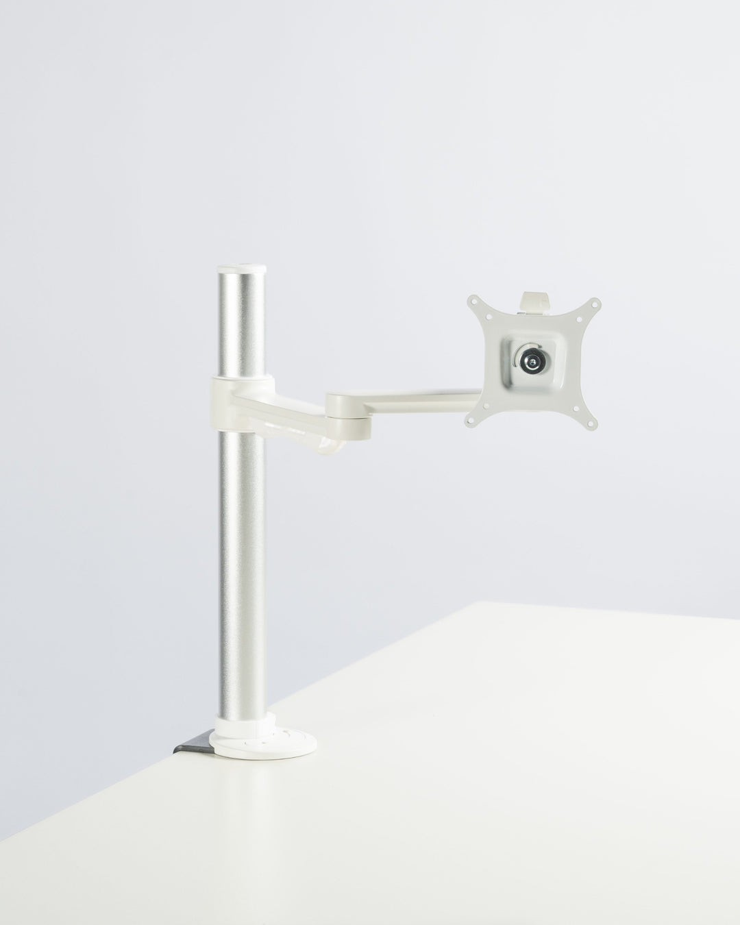 Thinking Works C.ME single monitor arm in matte white, second angle, studio (Thinking Works photograph)