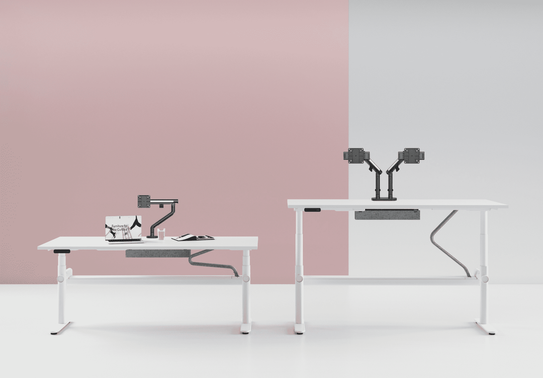 Office scene with Thinking Works Glider monitor arms on sit-stand desks