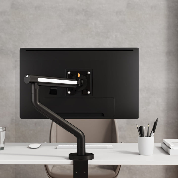 Thinking Works Glider single monitor arm holding a screen on a desk, front view