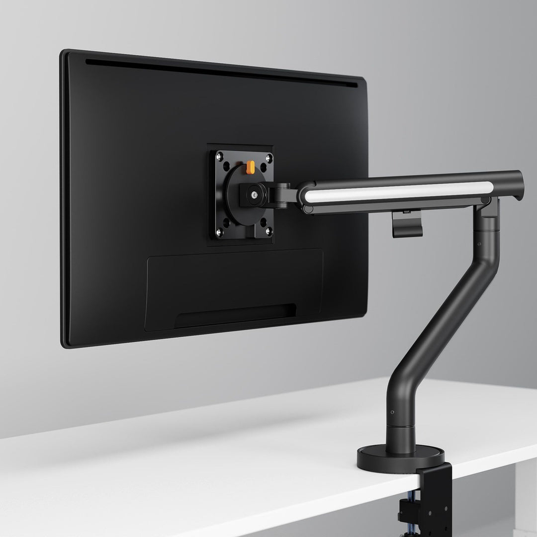 Thinking Works Glider single monitor arm with screen, angled view on a desk