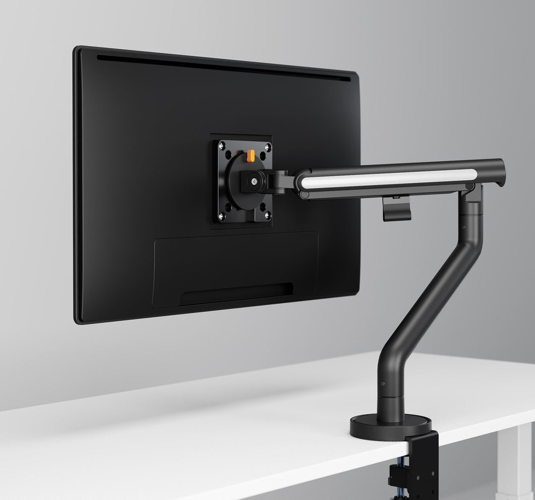Thinking Works Glider single monitor arm with screen, angled view on a desk