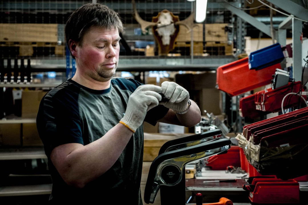 Technician assembling a HÅG chair at Flokk's factory in Røros, Norway